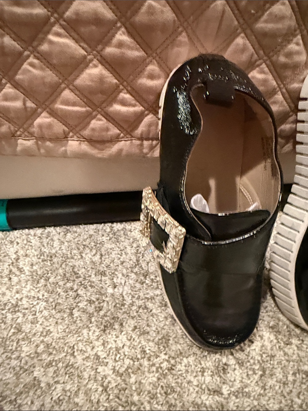 Black patent leather shoe with studded buckle